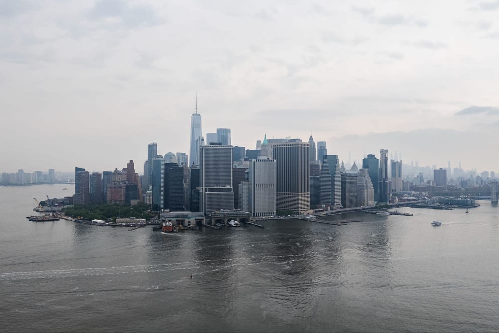 Lower Manhattan skyline seen through harbor haze