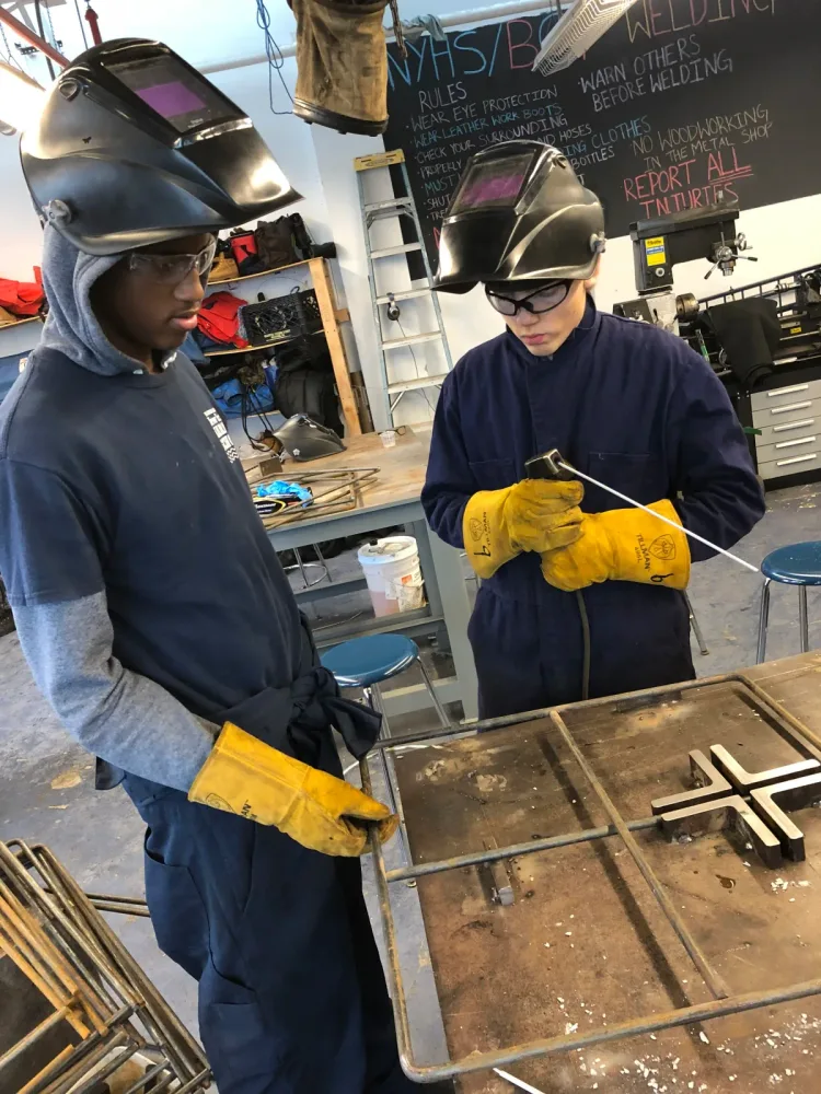 Students work with equipment inside a marine laboratory