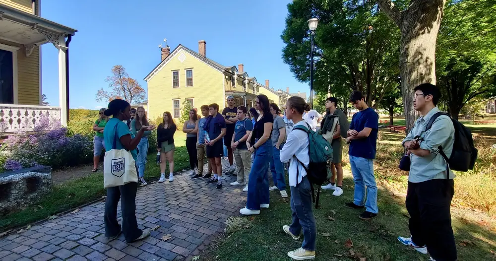 Visitors on a guided walking tour of Billion Oyster Project's site on Governors Island