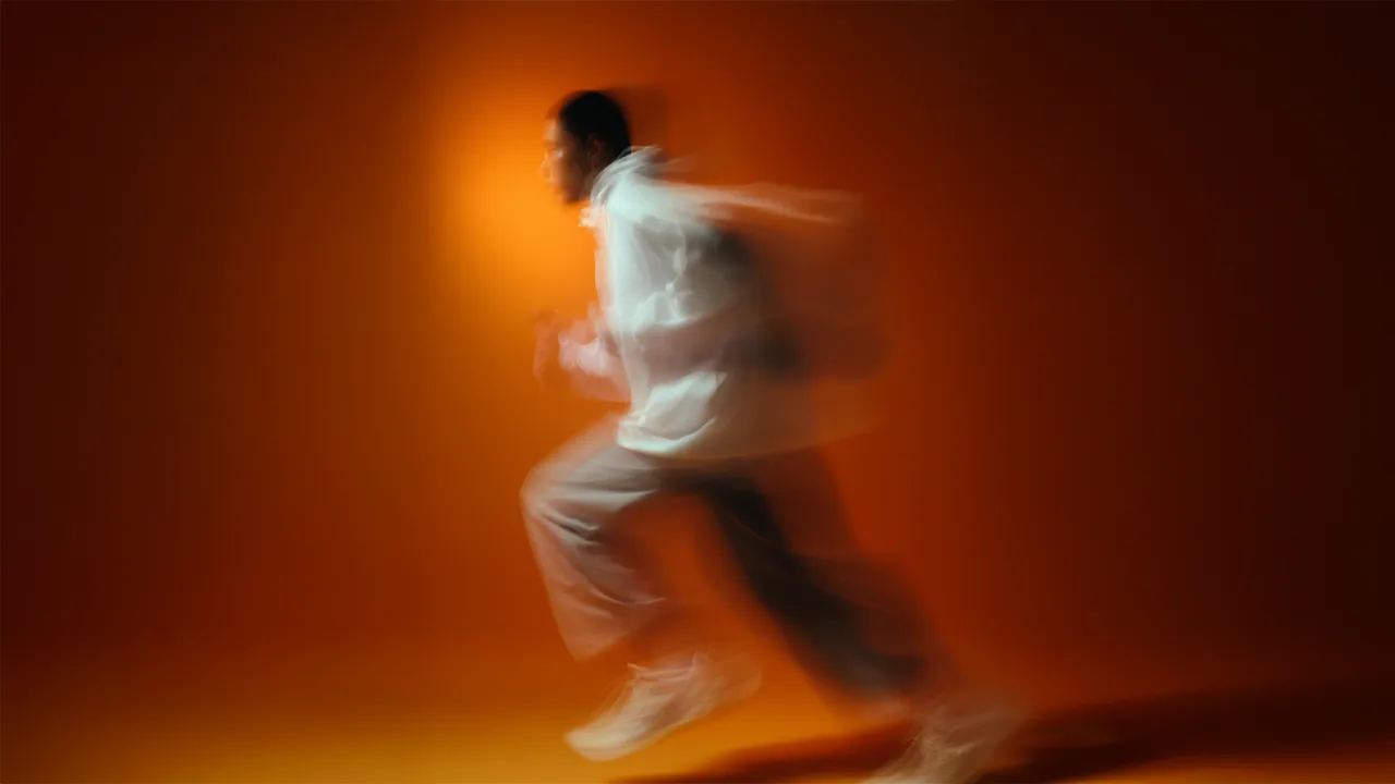 Running motion blur on orange
