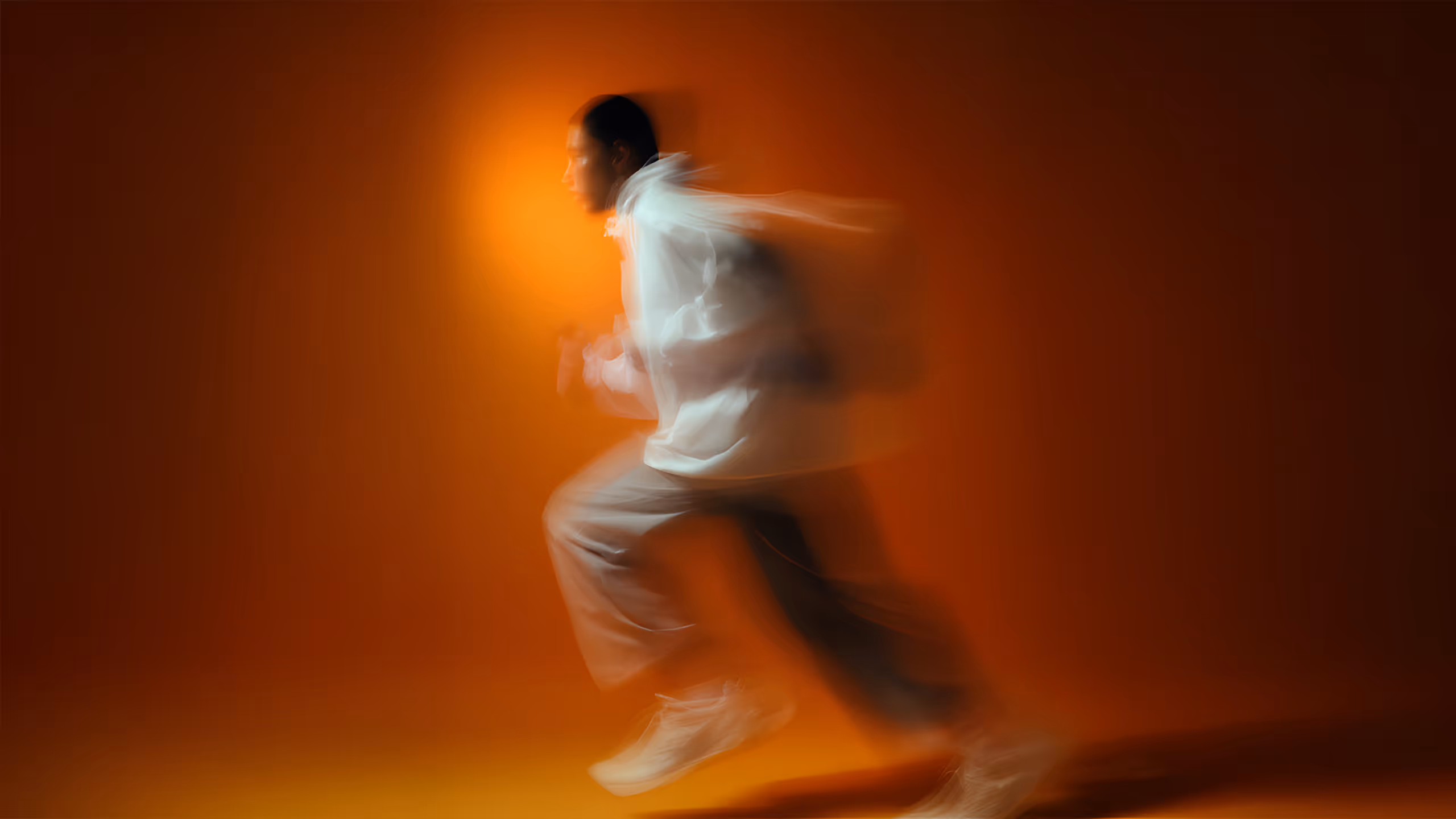 Running motion blur on orange