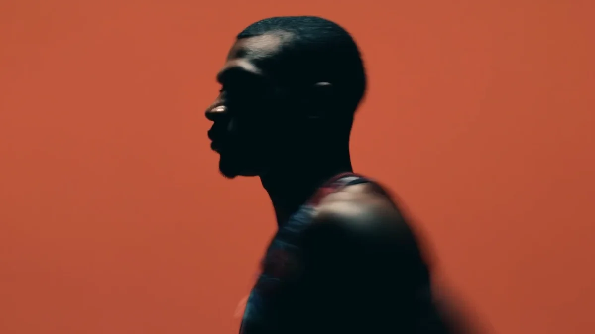 Futuristic visual of a human silhouette against a red background representing edge computing innovation