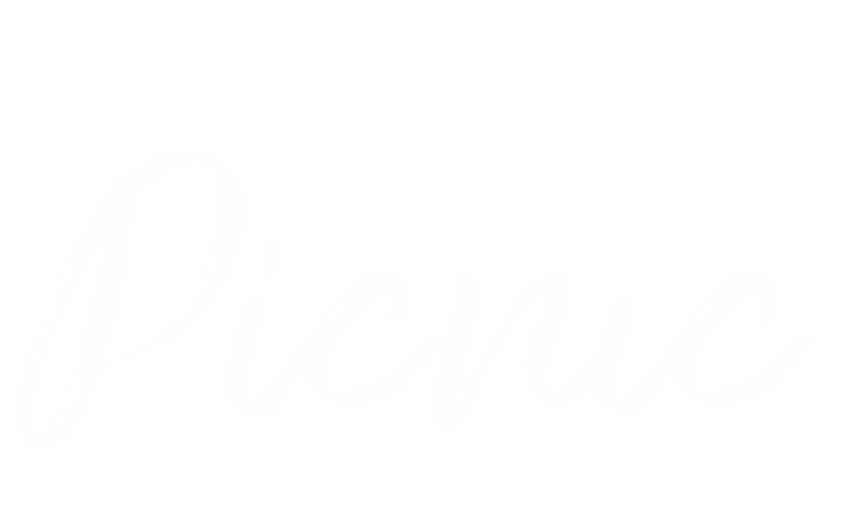 White script text reading Picnic with a floral design and smaller text below saying By The Black Parrot.