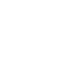 Black and white pixelated icon resembling a camera with a circular lens and a small square flash.