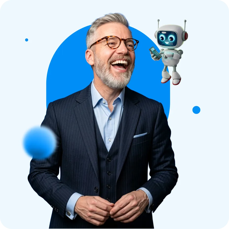 Smiling middle-aged man in a dark pinstripe suit with glasses standing next to a small friendly robot holding a smartphone.