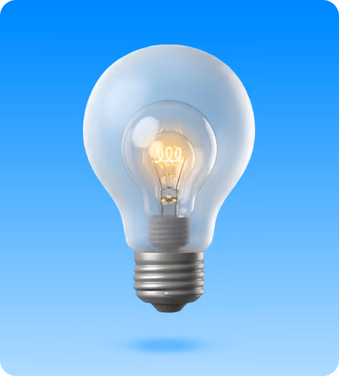A smaller glowing incandescent light bulb inside a larger translucent light bulb on a blue gradient background.