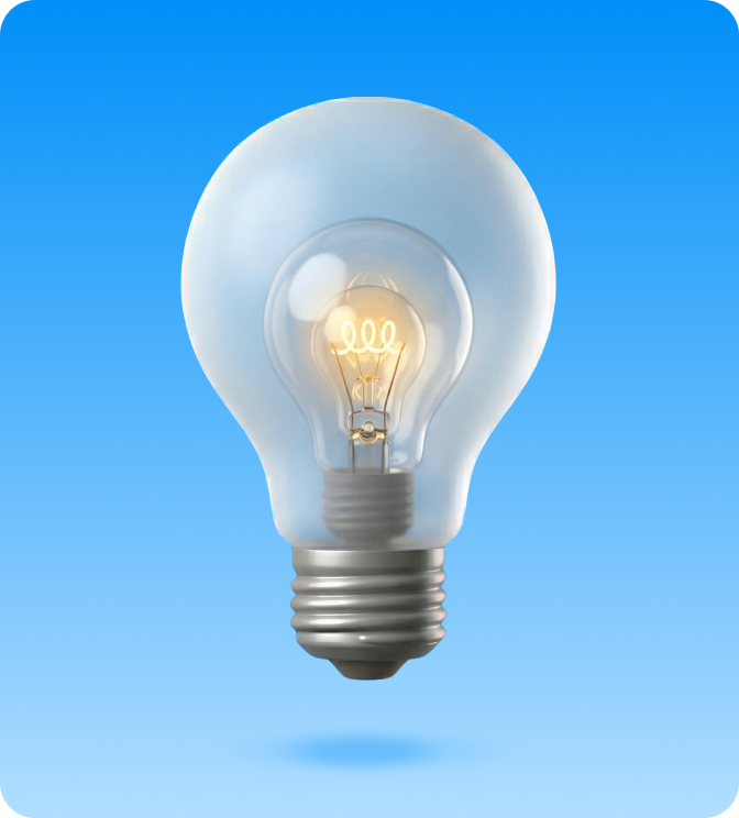 A smaller glowing incandescent light bulb inside a larger translucent light bulb on a blue gradient background.