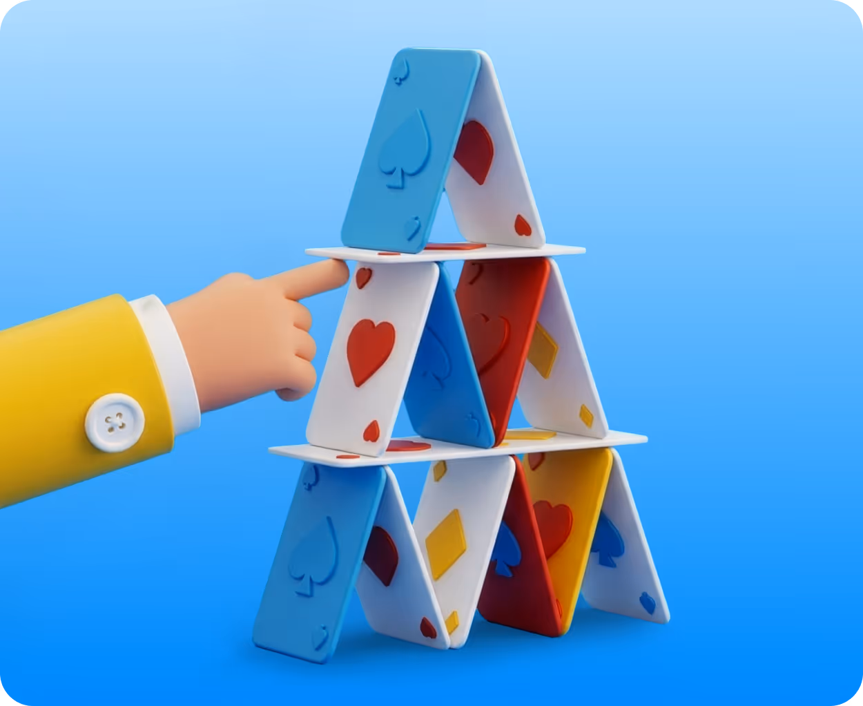 Hand with yellow sleeve gently touching a card in a colorful house of cards pyramid on a blue background.