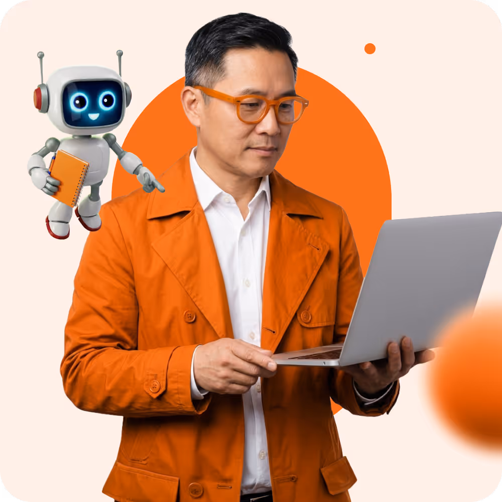 Man in orange jacket and glasses holding a laptop with a smiling robot holding a notebook beside him.