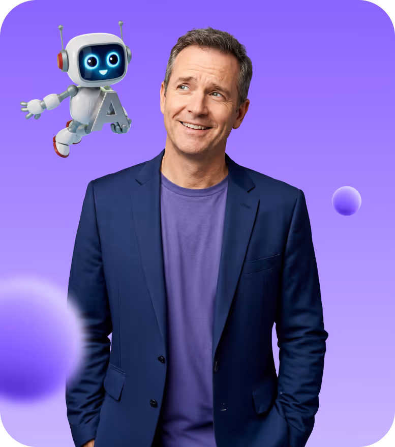 Smiling man in a blue blazer and purple shirt looking at a cheerful flying robot holding the letter A on a purple gradient background.