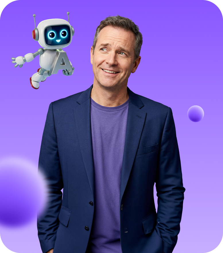 Smiling man in a blue blazer and purple shirt looking at a cheerful flying robot holding the letter A on a purple gradient background.