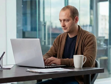 female-manager-focusing-her-laptop 1