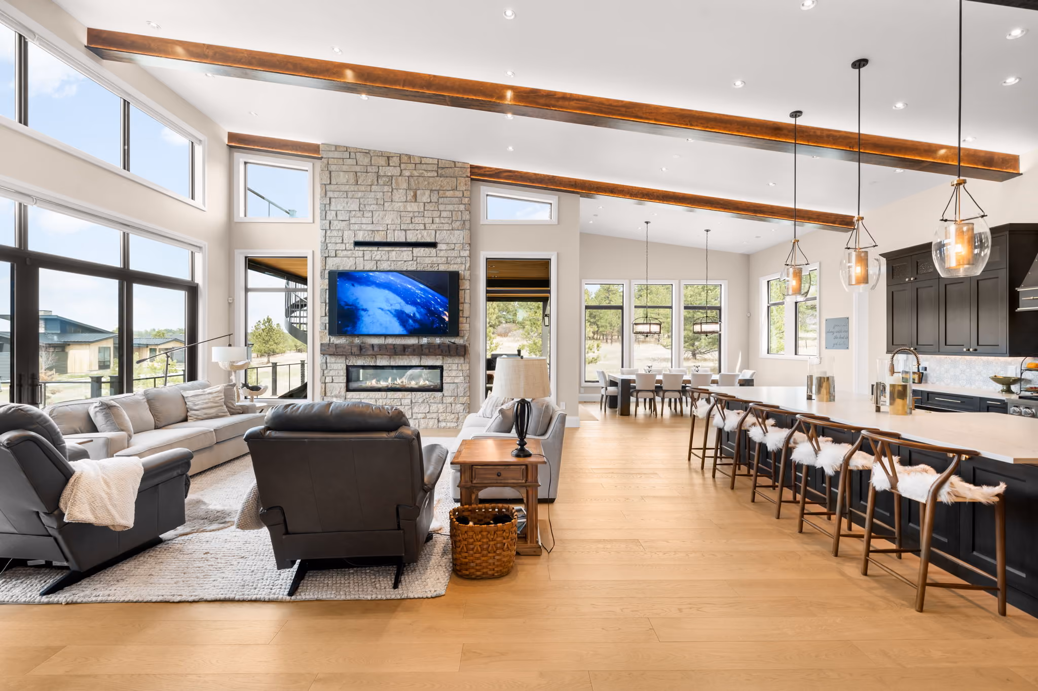 Open concept living kitchen beamed ceiling, architectural lighting design by QAV in Colorado