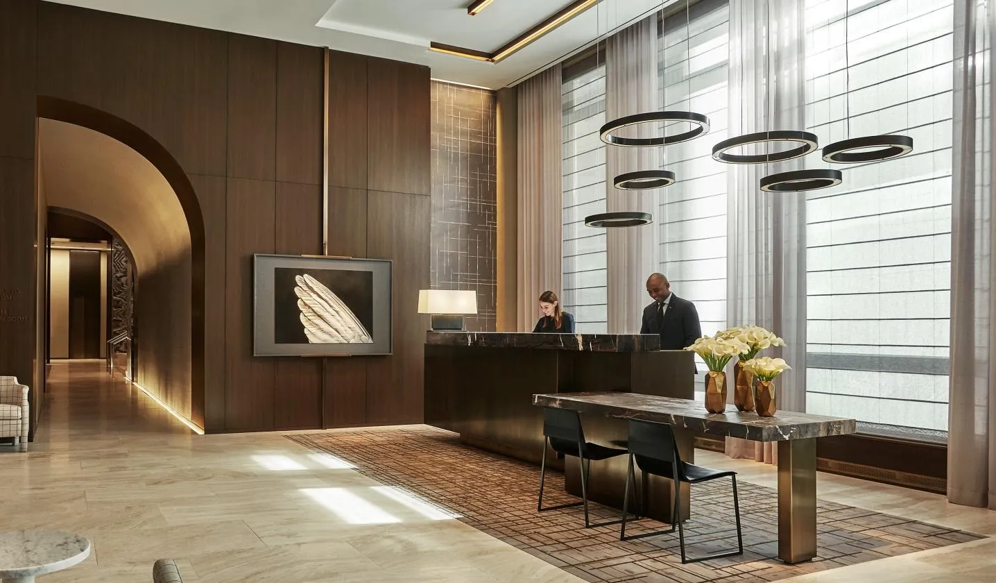 Hotel lobby reception desk ring pendants, luxury residential smart home technology by QAV in Colorado