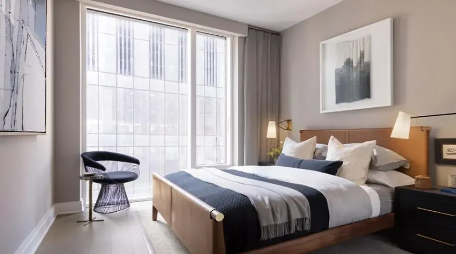 Hotel bedroom city view leather headboard, luxury hospitality technology by QAV in Colorado