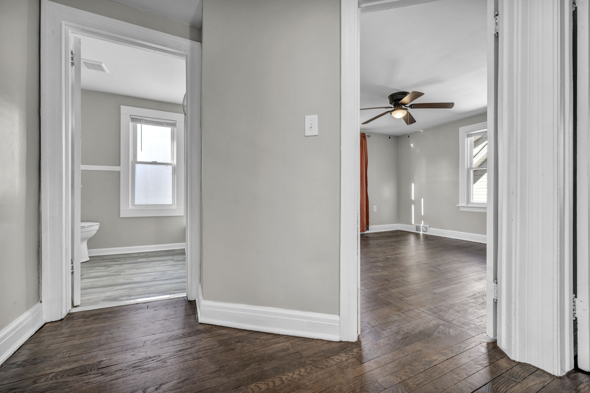 picture of hallway with doors open into rooms upstairs