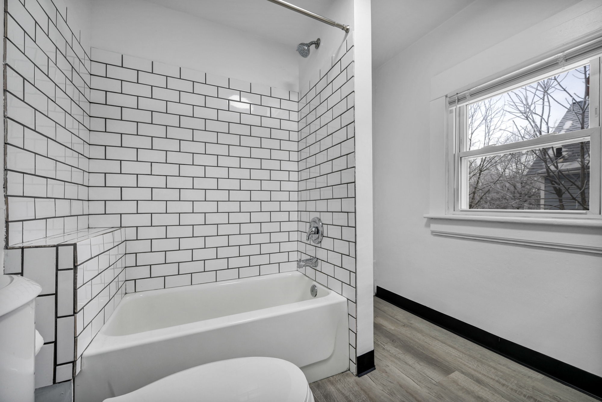 Bathroom view of shower and tile