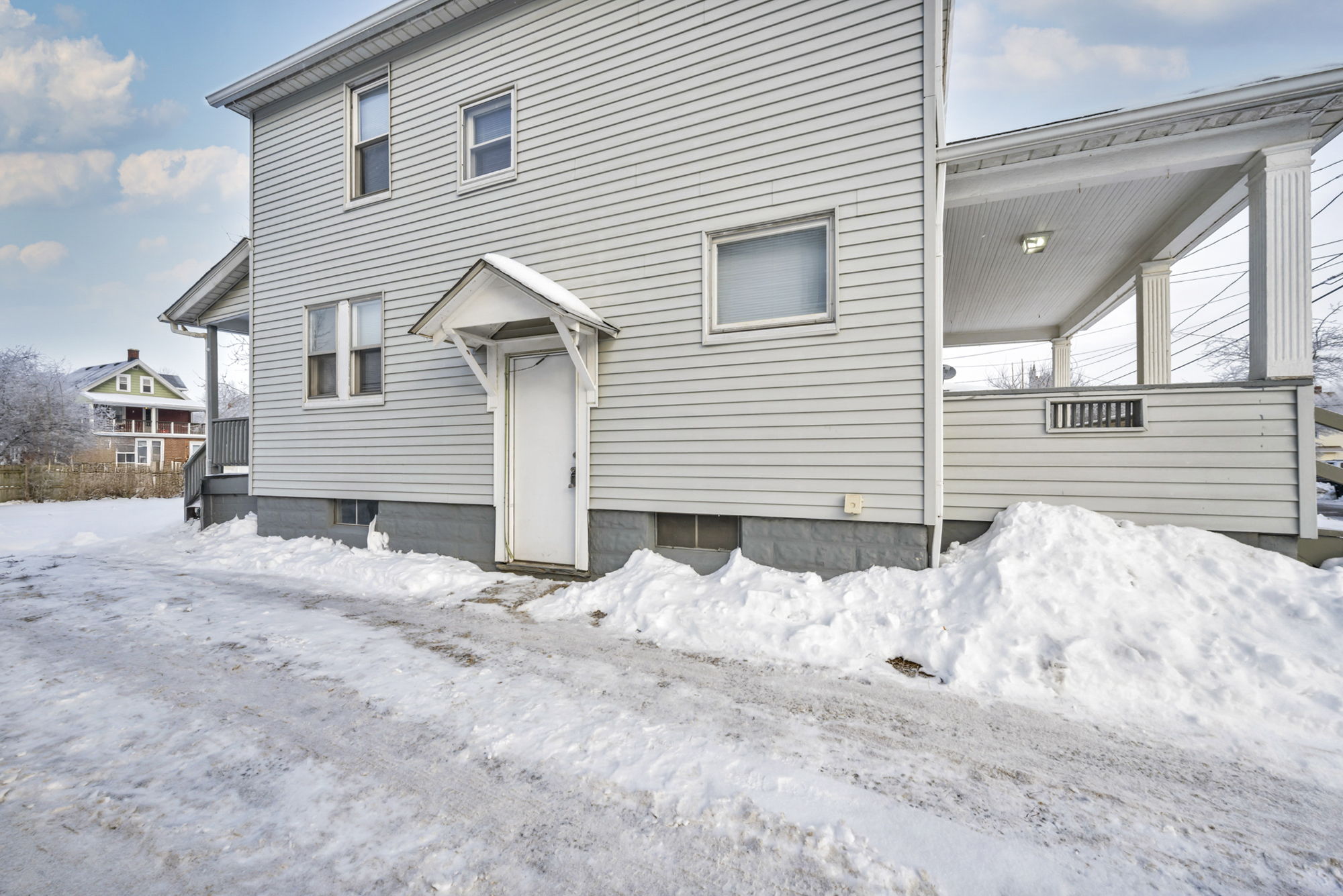 Driveway and side of home at daytime