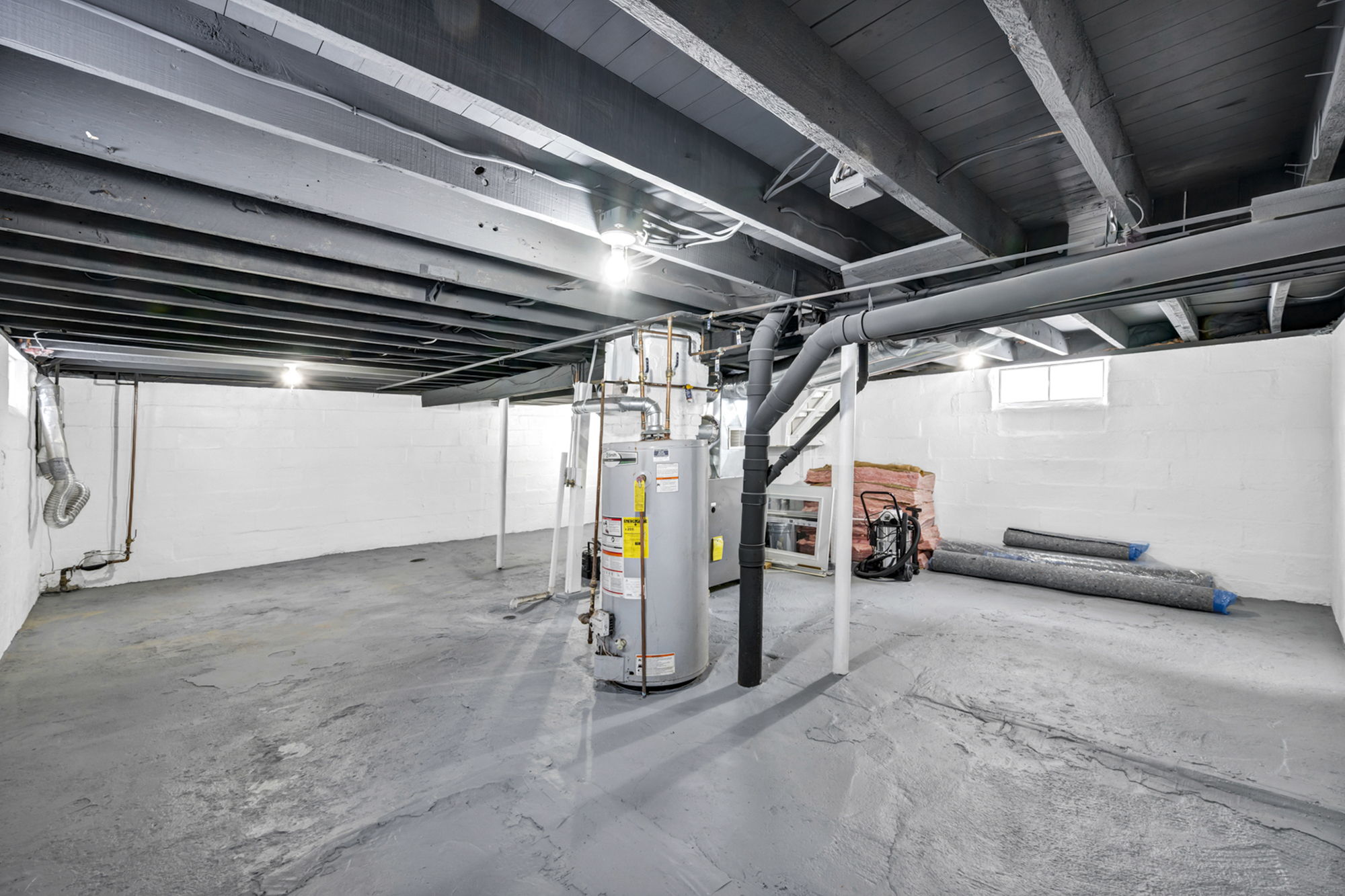 basement full view with stairs and mechanics