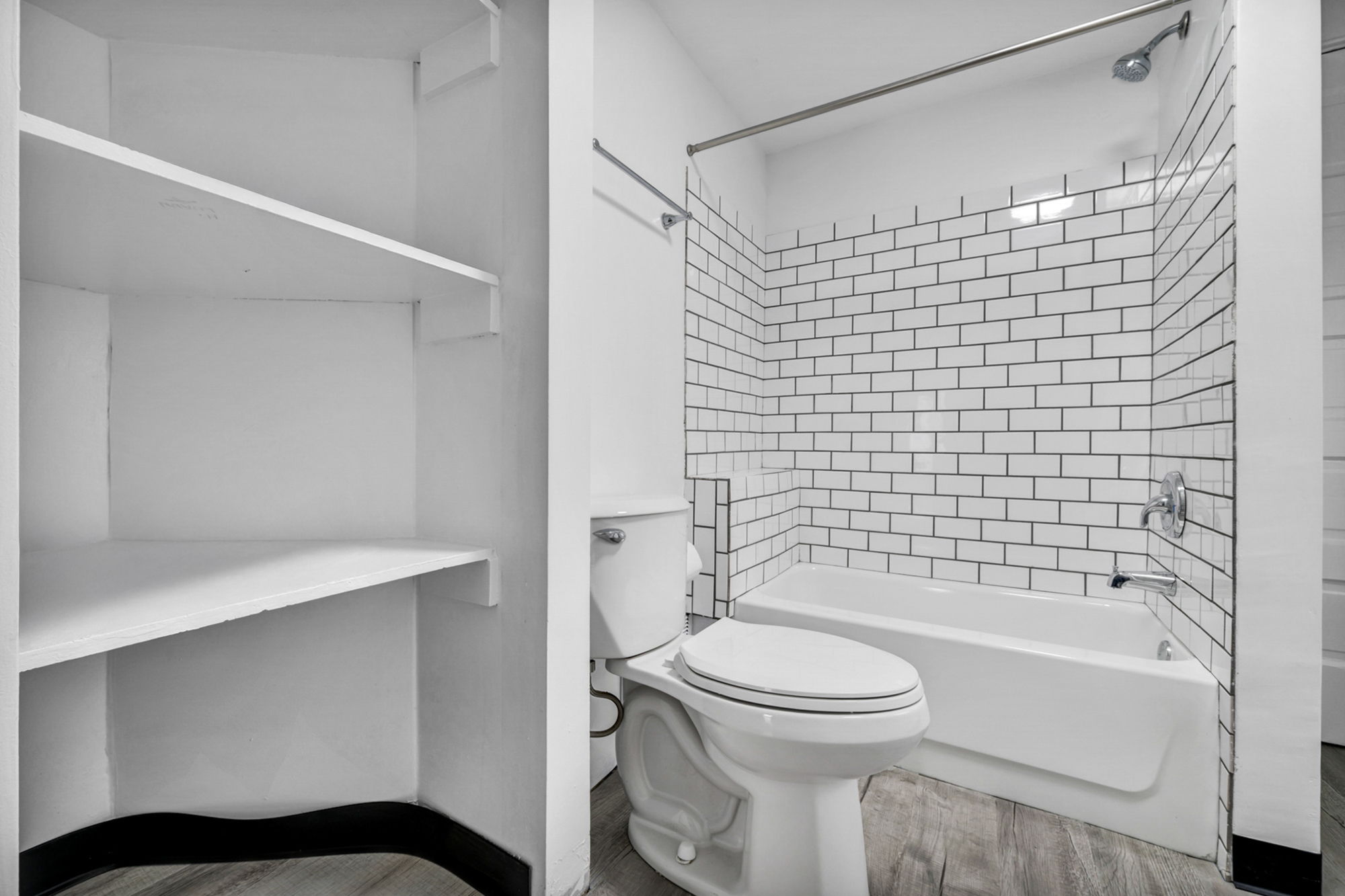 Full bathroom View of tile and towel cabinets