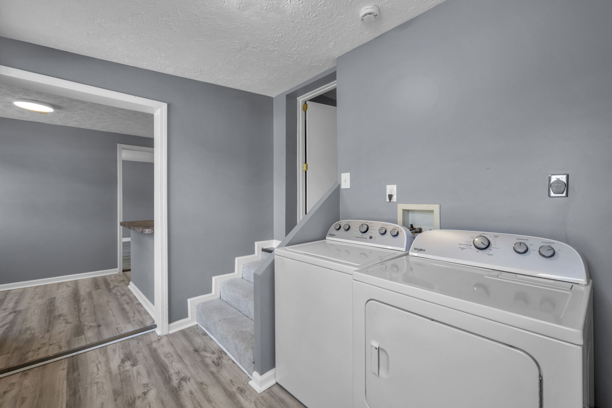 laundry appliances and hallway to kitchen