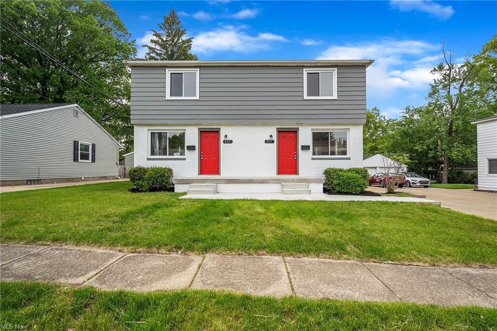 duplex at daytime with red doors