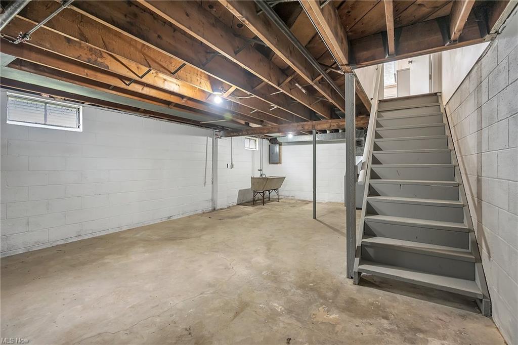 basement with stairs going up