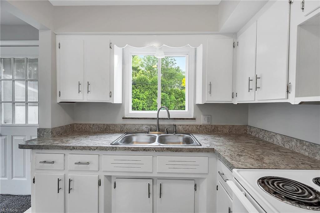 kitchen sink with windows above