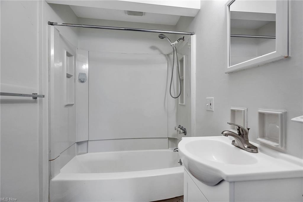 shower with bathtub, shower combo and vanity with sink