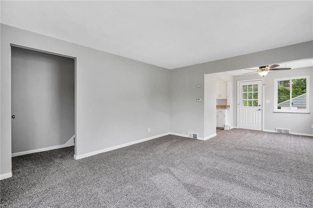 living room with closet door open and carpet