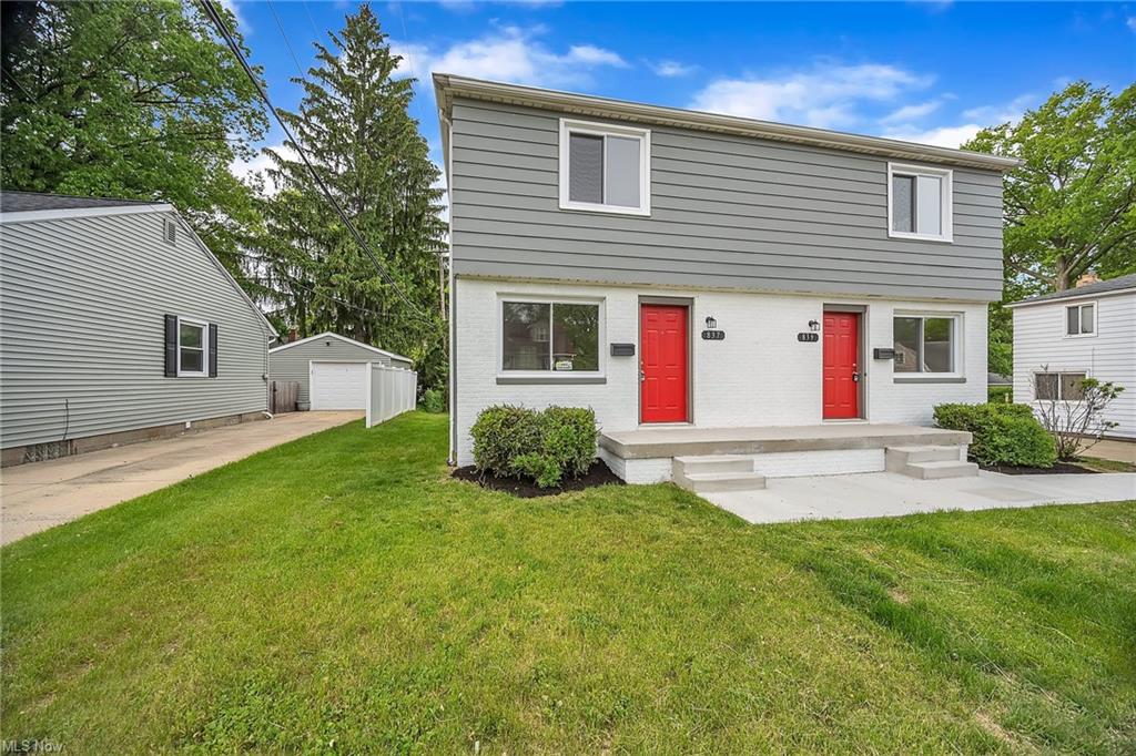 red door duplex front photo at street from angle at daytime