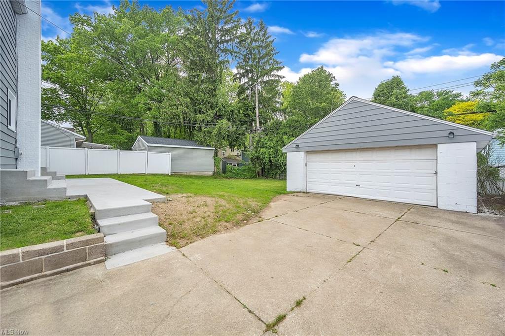 two car garage with new contrete stairs adjacement and concrete driveway