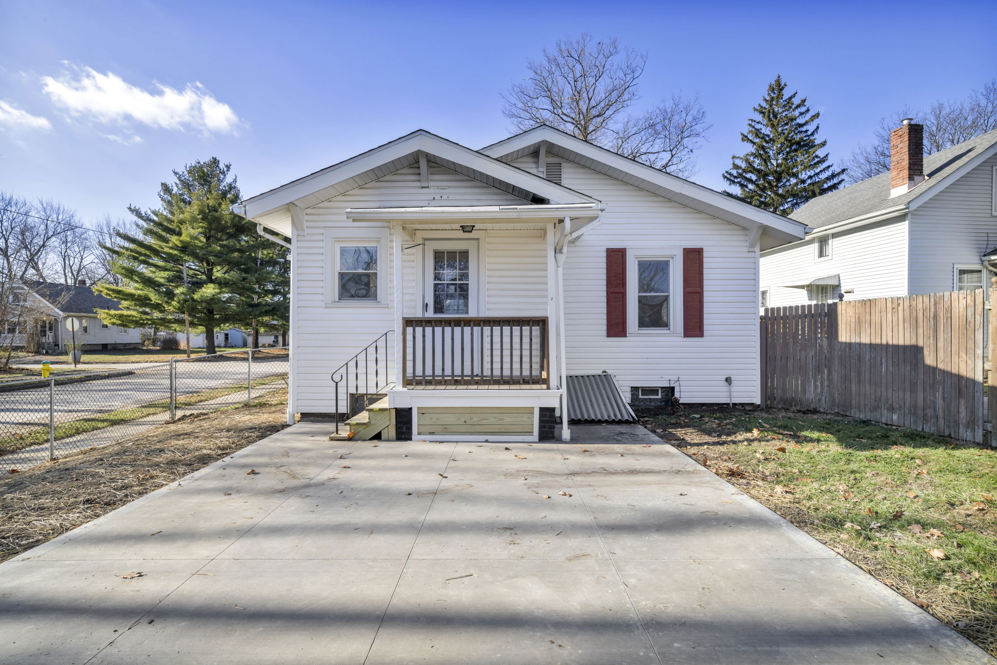 backyard photo with house and concrete slab