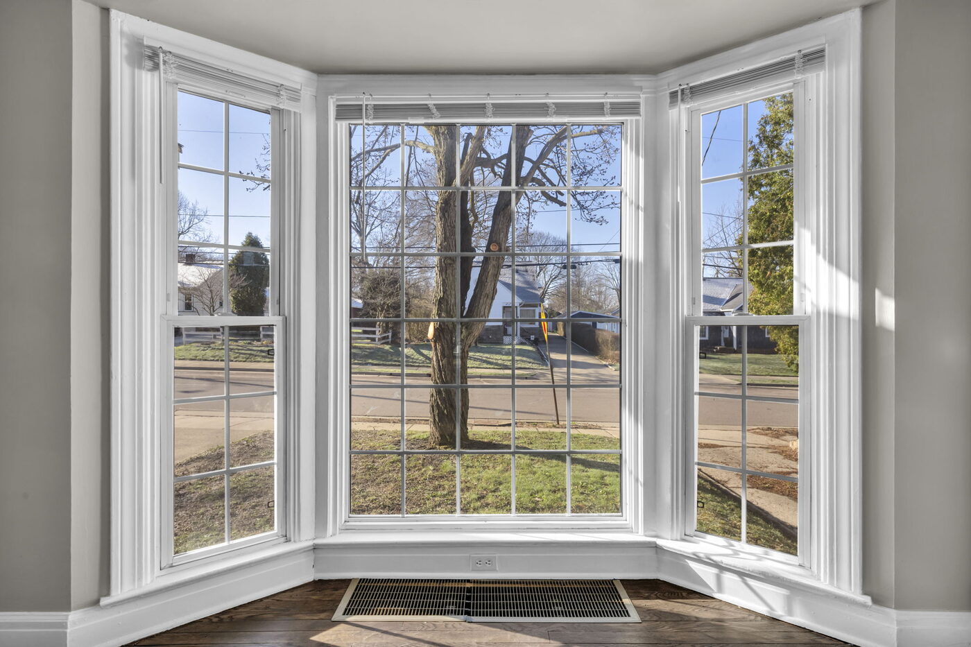 Large 3-piece window looking out to a fall street
