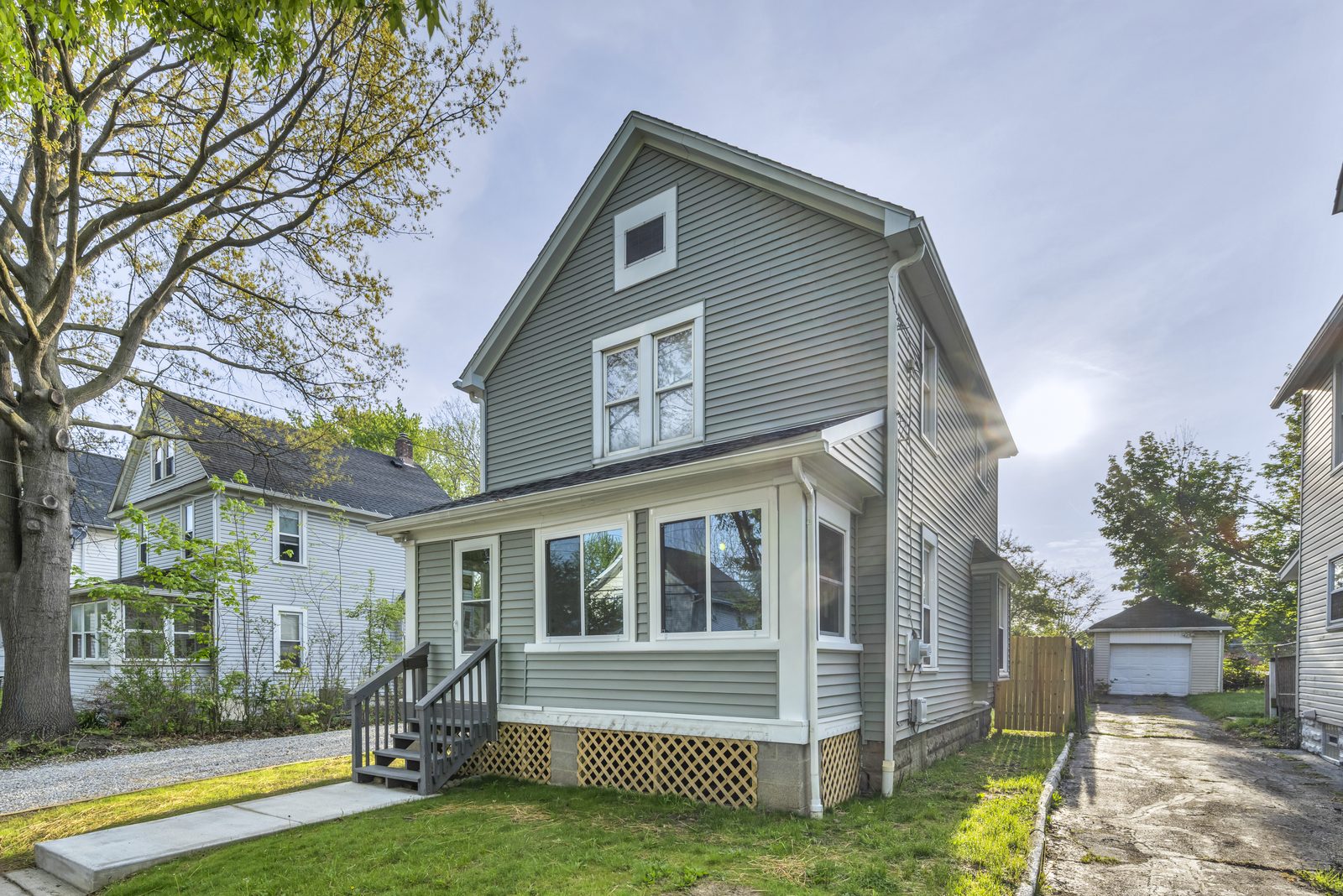 small century colonial in akron with green grass