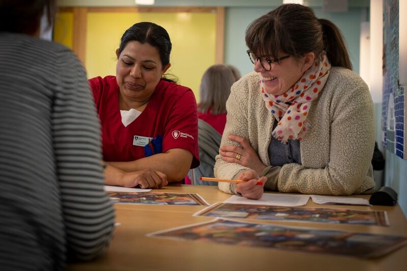 People taking part in a work shop. 