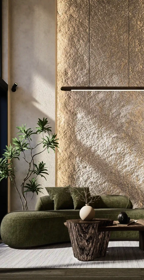 Modern villa interior with textured stone walls, natural materials, and minimalist seating in Bali.