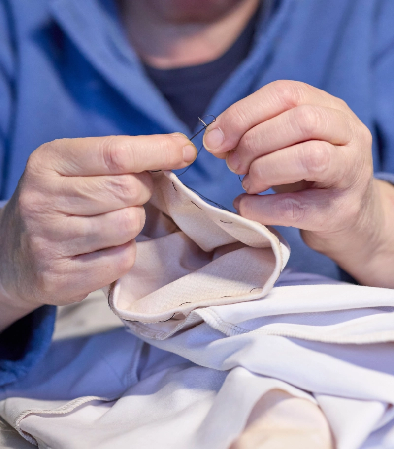 a person repairing clothing