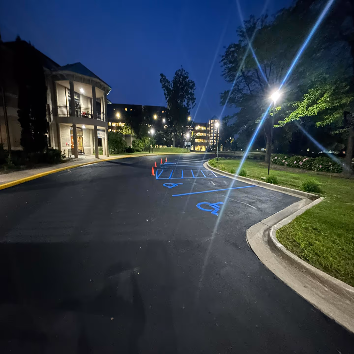 Professional commercial parking lot sealcoating for Grand Traverse Pavilions on S Elmwood Ave and Medical Campus Dr in Traverse City, MI.