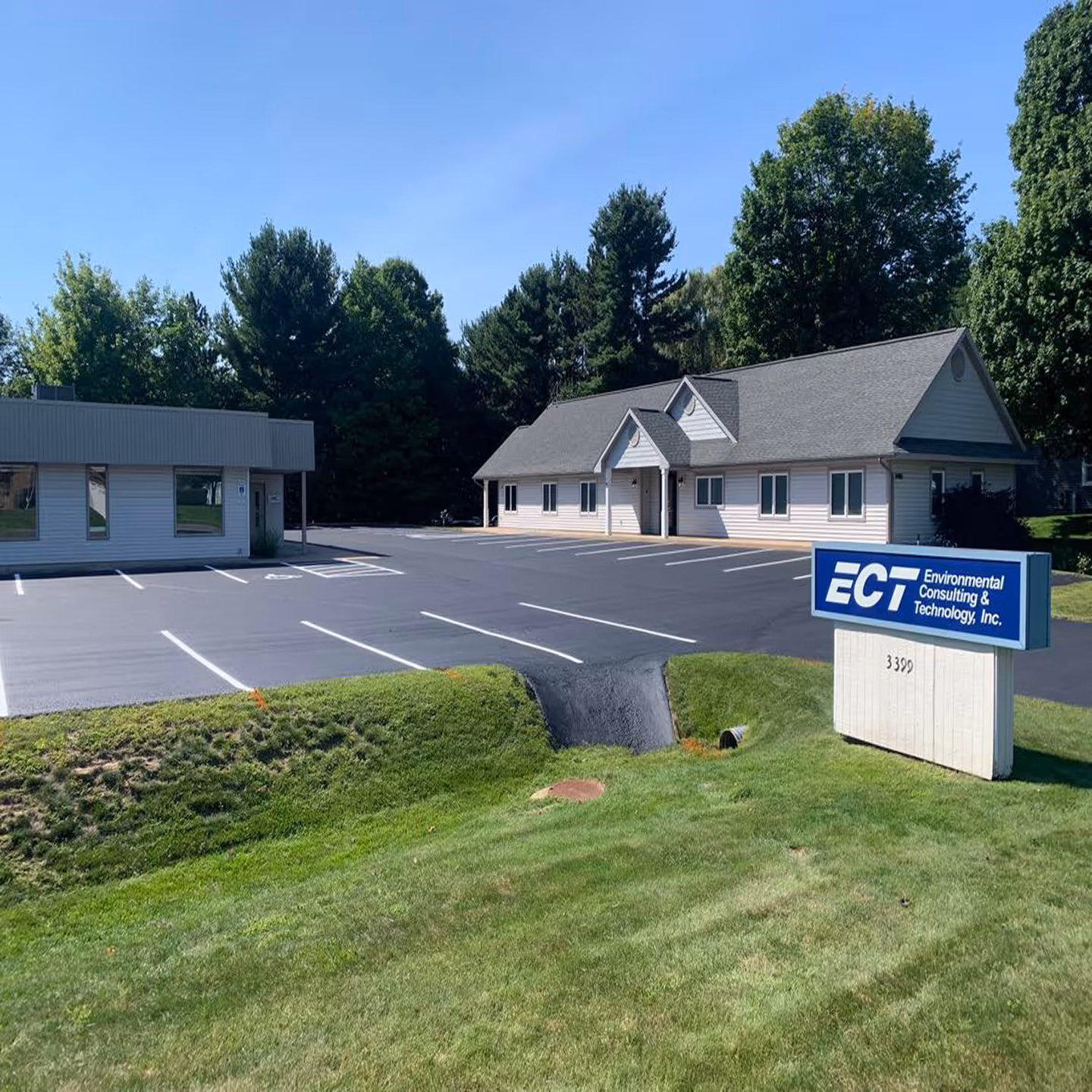 Professional commercial parking lot sealcoating for Environmental Consulting & Technology on Veterans Dr in Traverse City, MI.