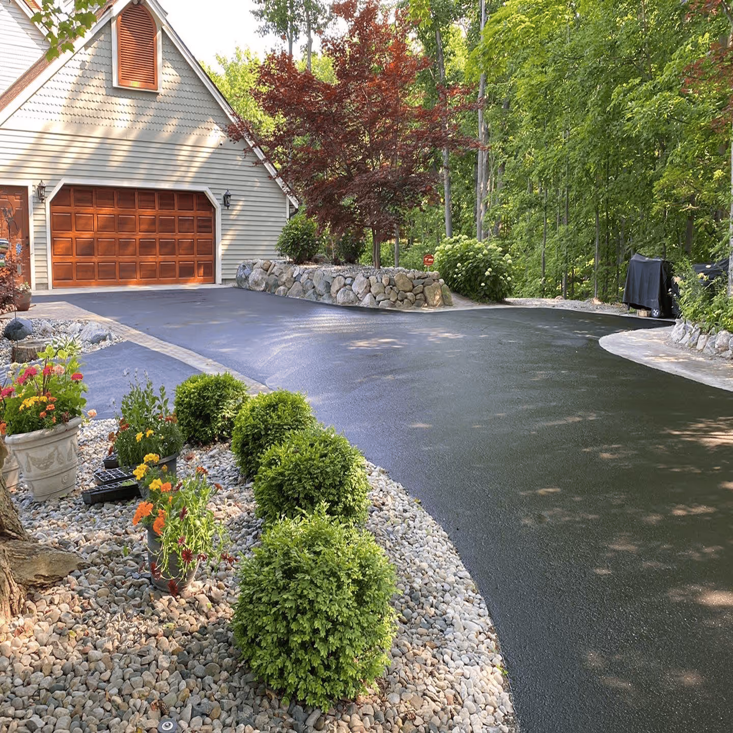 Residential asphalt maintenance and sealcoating for a private drive in the village of Leland.