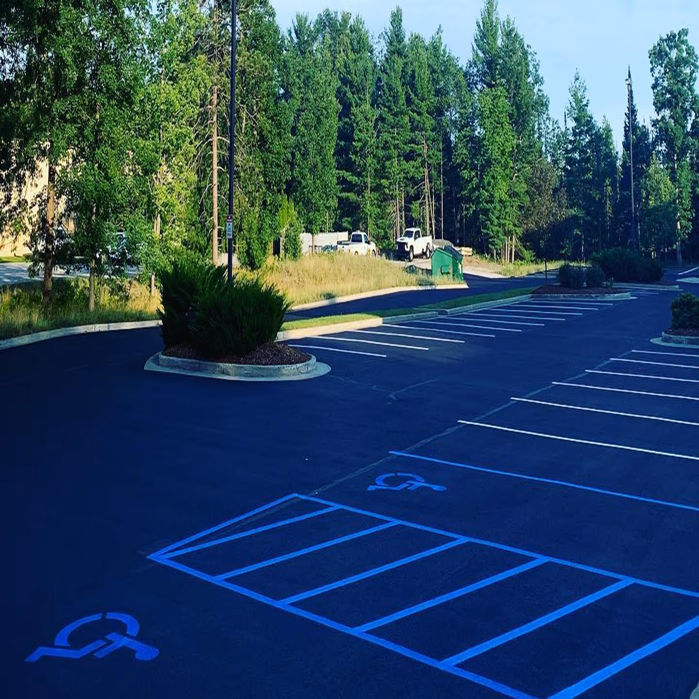 Professional commercial parking lot sealcoating for Oilgear on International Dr in Traverse City, MI.