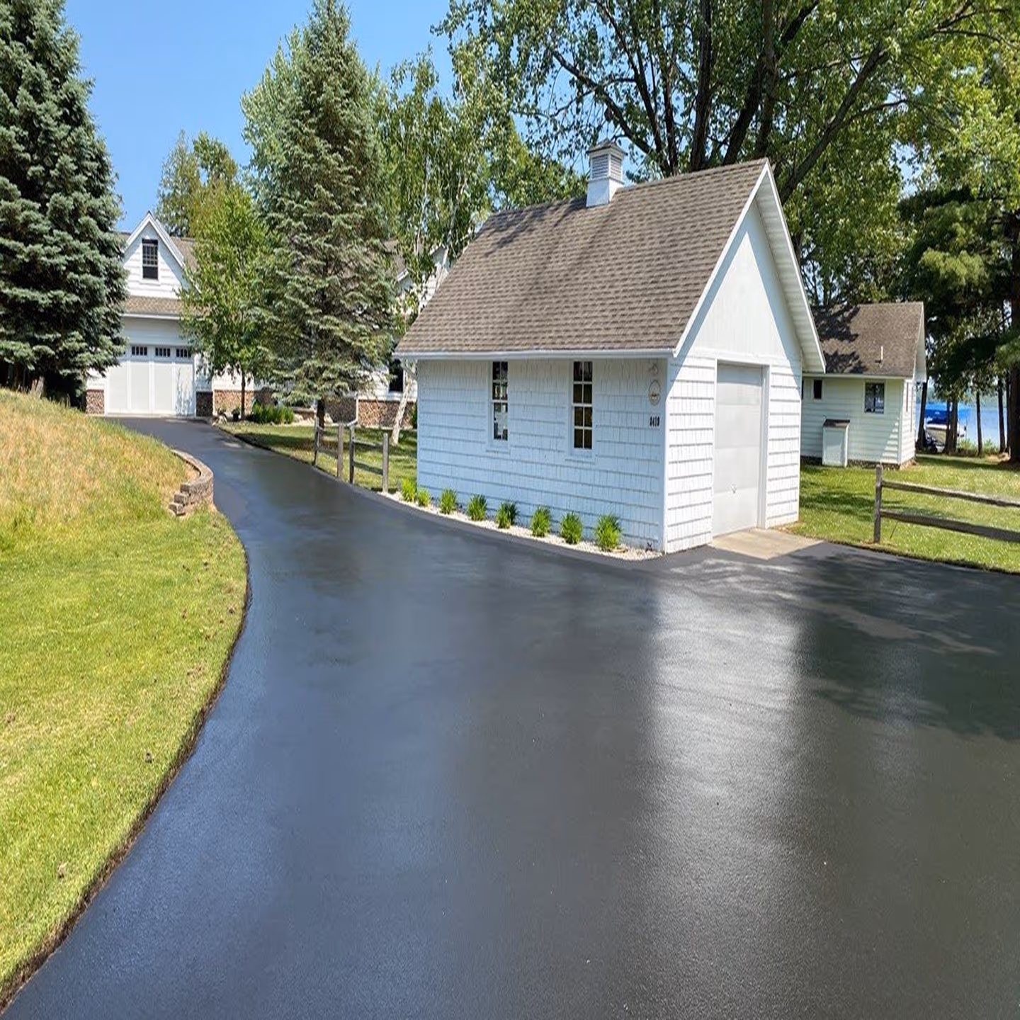 High-quality asphalt sealcoating applied to a residential driveway in Glen Arbor.