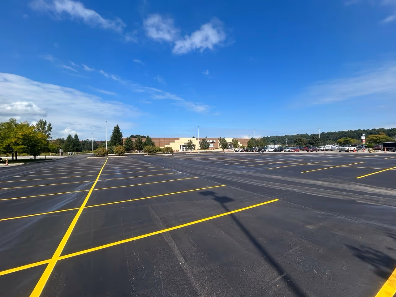 A professional new parking lot layout and precision line striping at the Kohl’s department store on N US-31 S in Traverse City, MI. This large-scale project, completed for Countrywide Paving & Concrete, features high-visibility white pavement markings designed for high-volume retail traffic.