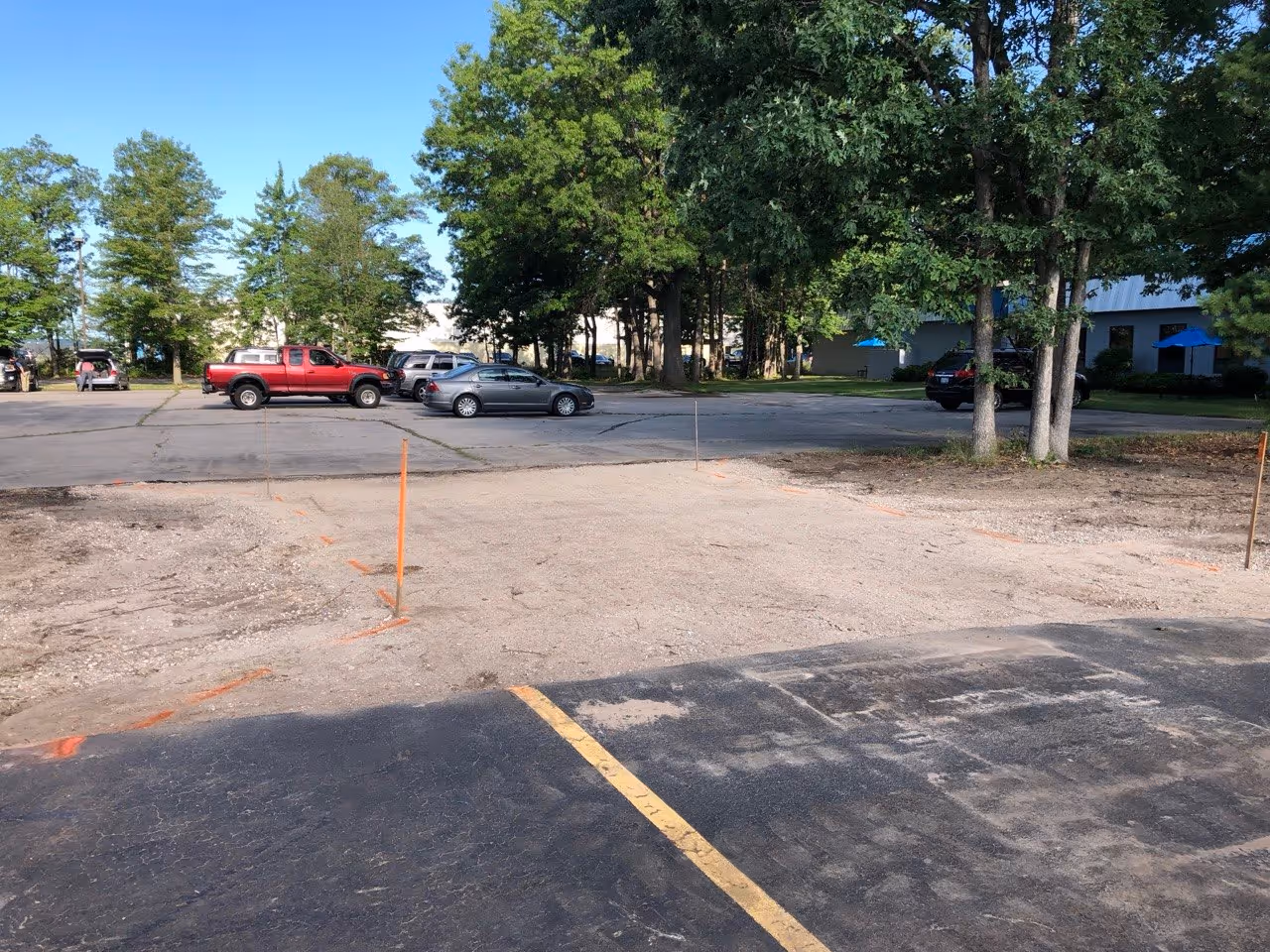 The commercial roadway area at Hagerty Insurance is fully prepped and ready for hot-mix asphalt. The aggregate base is fine-graded and compacted, ensuring a seamless transition between the two existing parking facilities.