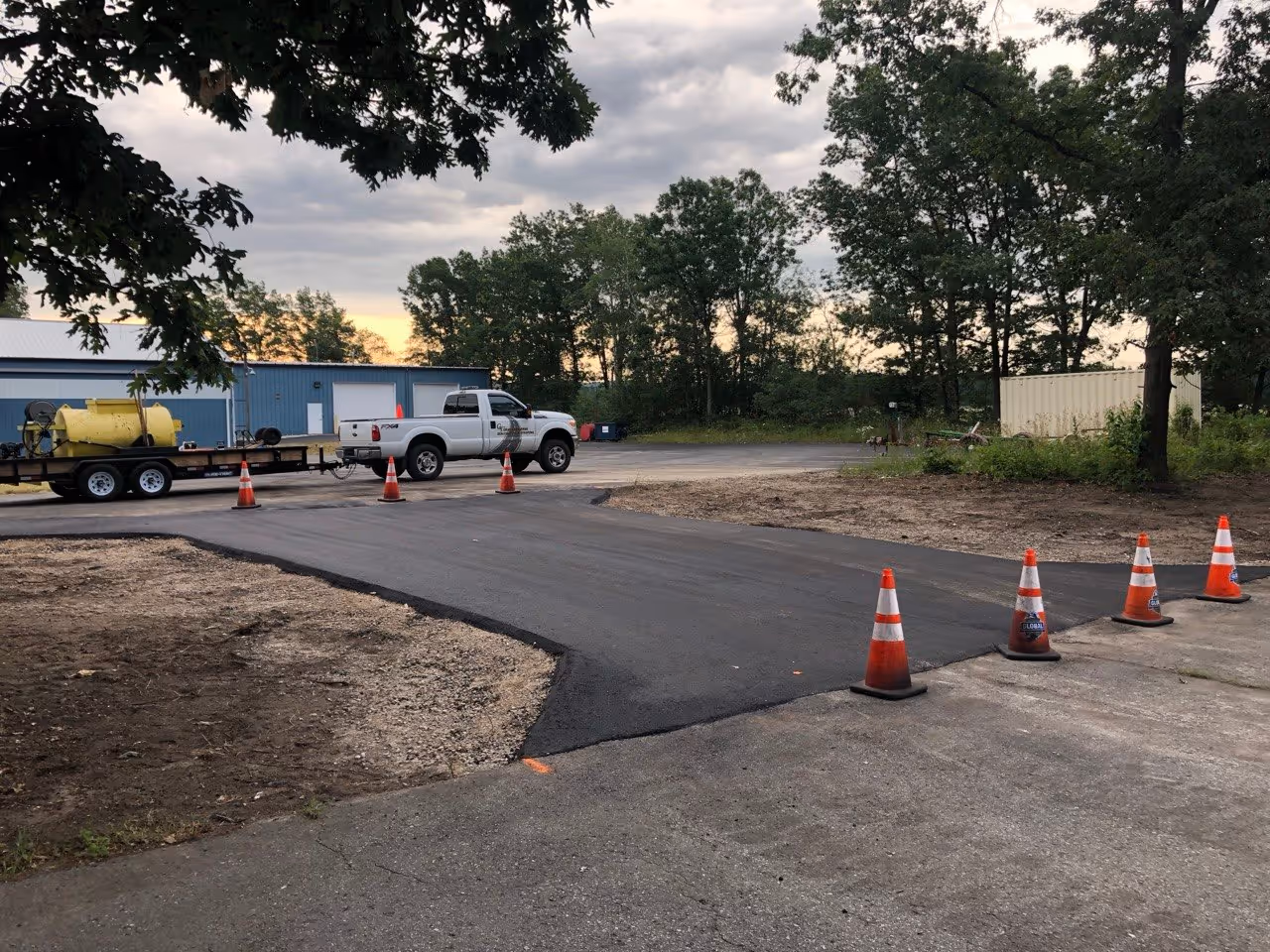 The final completed asphalt roadway at Hagerty Insurance Agency in Traverse City, MI. The new link provides a safe and durable connection between parking areas, completing the commercial site improvement project on Aero-Park Dr.