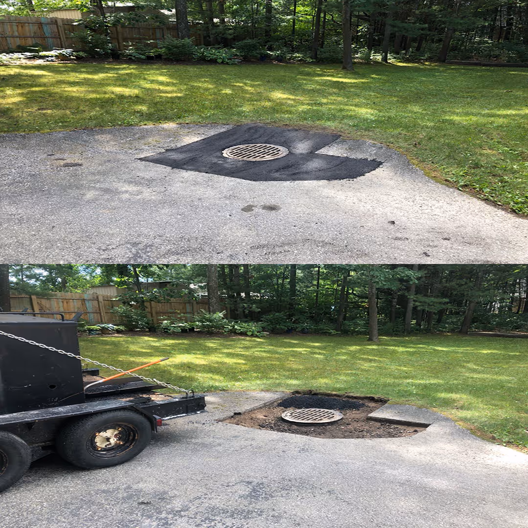 A before and after comparison of a residential driveway drainage project in Interlochen, Michigan, showing the transformation from a failed drainage area to a finished catch basin and water drainage system with fresh asphalt paving designed to manage water runoff and prevent driveway flooding.
