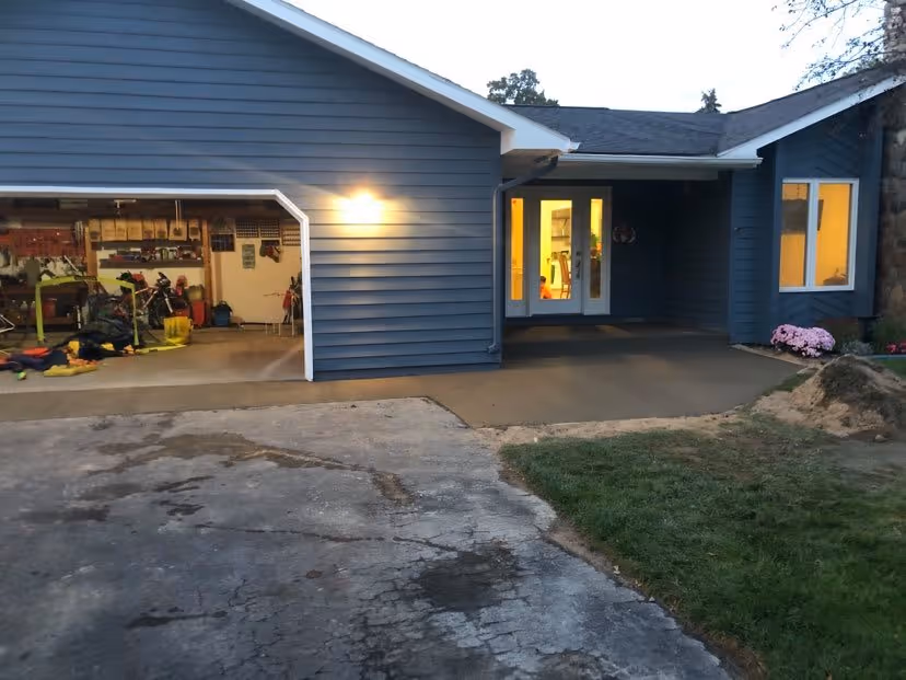 Freshly poured concrete with a non-slip broom finish for a new front porch and sidewalk at an Old Mission Peninsula home in Traverse City, MI.