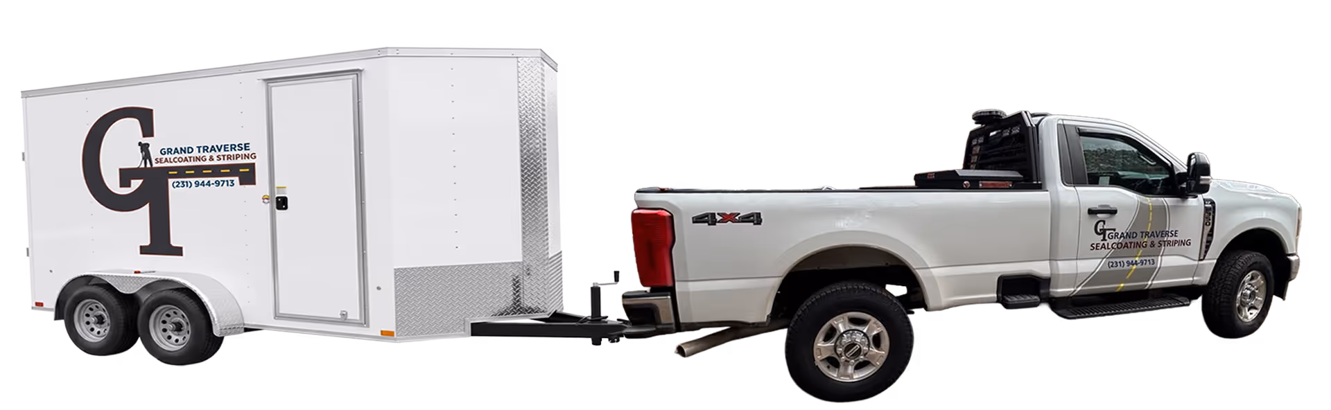 Professional Ford F-350 truck and a custom enclosed parking lot striping trailer ready for commercial pavement marking projects across Traverse City and Northern Michigan.