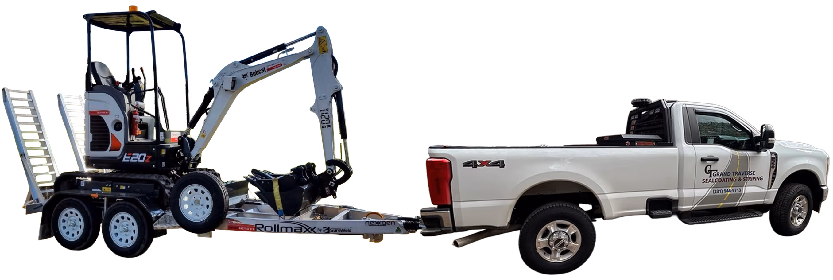Professional Ford F-350 truck towing a Bobcat excavator on a heavy-duty equipment trailer. Grand Traverse Sealcoating & Striping’s mobile excavation fleet ready for culvert replacement and asphalt repair projects in Traverse City and Northern Michigan.